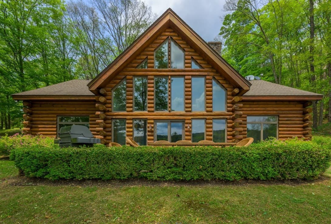 Private log lodge nestled among trees on the Hudson Valley property